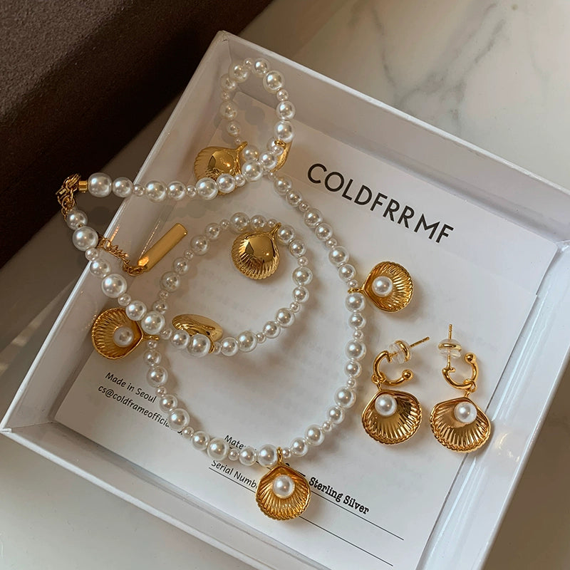 Unique designer European and American gold shell pearl necklace earrings set light luxury niche high-end sweater chain