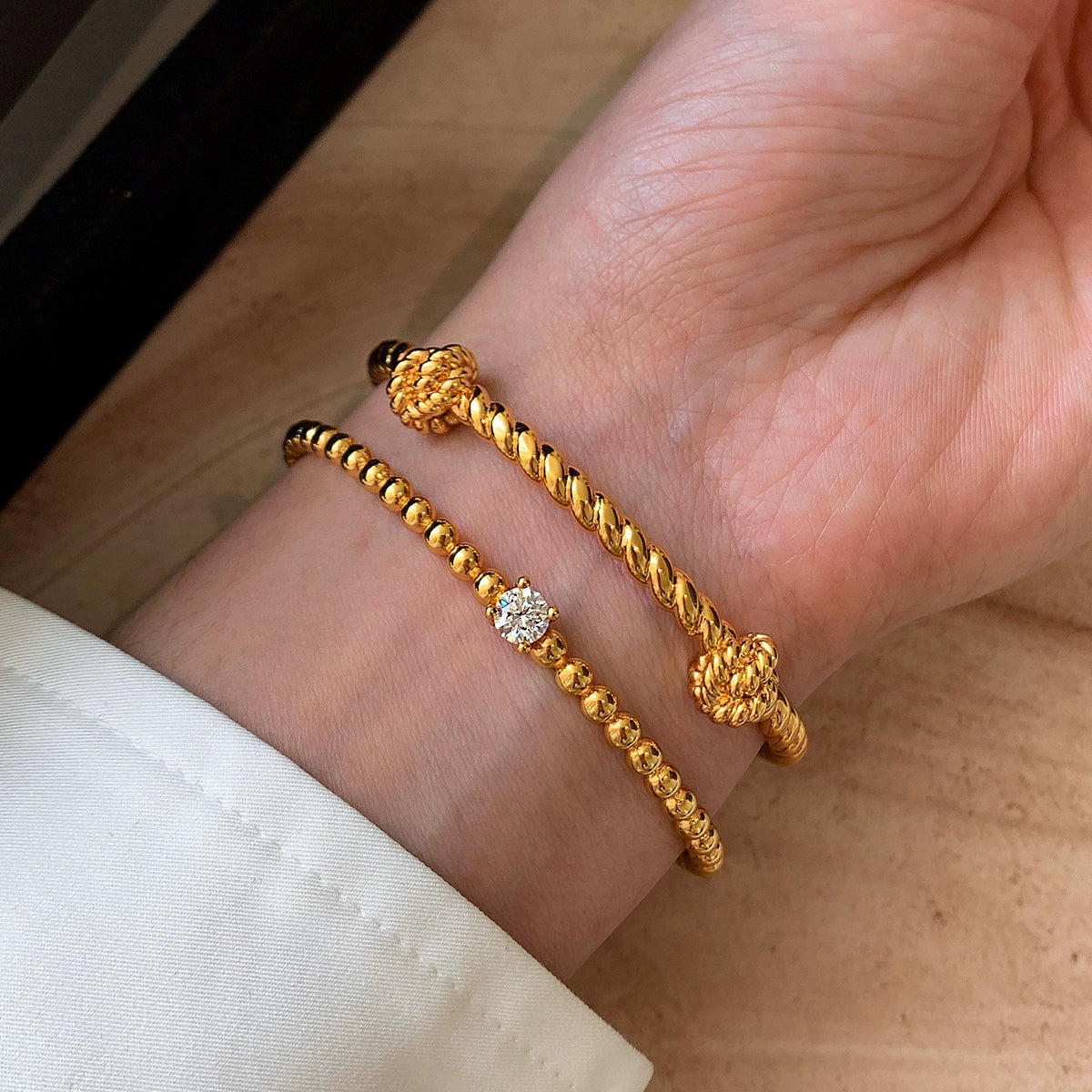 22K gold diamond-encrusted zircon knotted European and American metal bracelet women's light luxury exquisite fashion 2025 new bracelet