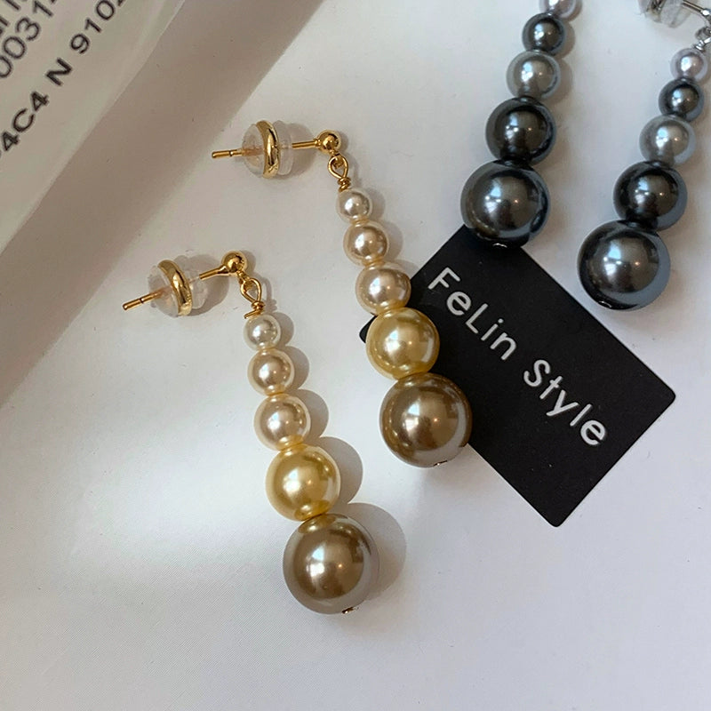 Gold size gradual change pearl stud earrings women 2025 new light luxury niche show face small long high-end earrings