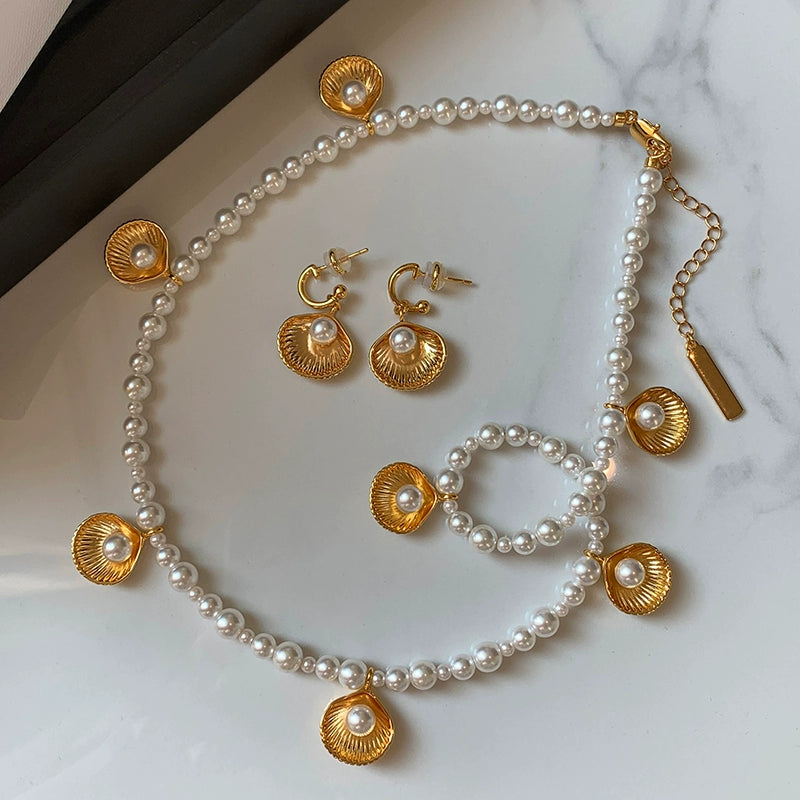 Unique designer European and American gold shell pearl necklace earrings set light luxury niche high-end sweater chain